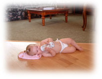 Baby on hardwood heated floor.